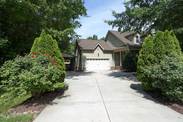 150 Churchill Rd, Louisburg, NC 27549 - view of front of property featuring driveway and a garage