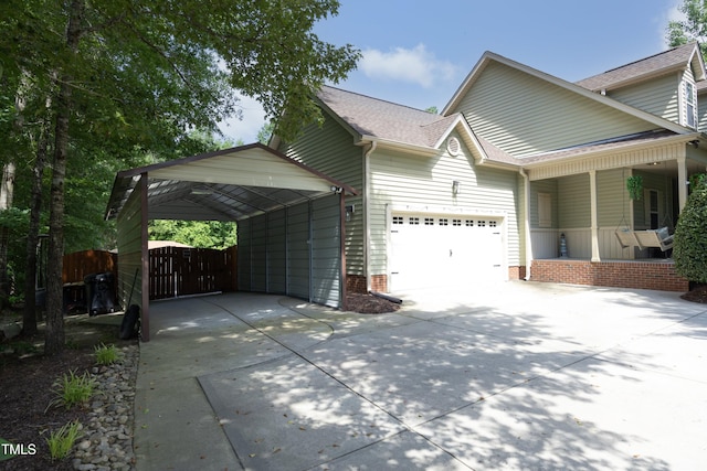 150 Churchill Rd, Louisburg, NC 27549 - view of property exterior with driveway, a garage, a shingled roof, a porch, and a gate