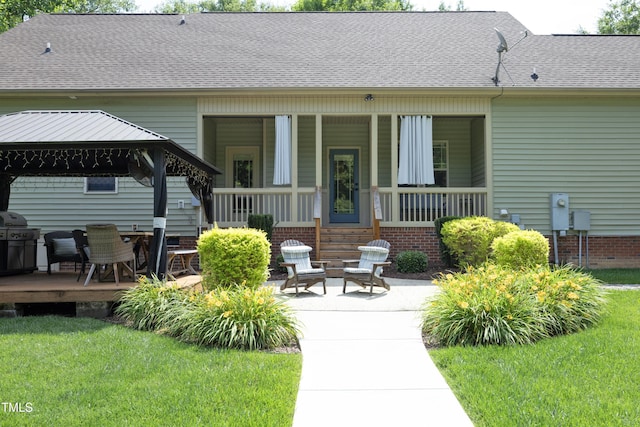 150 Churchill Rd, Louisburg, NC 27549 - rear view of house with a gazebo, a yard, roof with shingles, and a porch