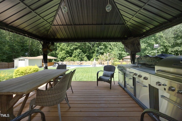150 Churchill Rd, Louisburg, NC 27549 - wooden terrace with outdoor dining area and exterior kitchen
