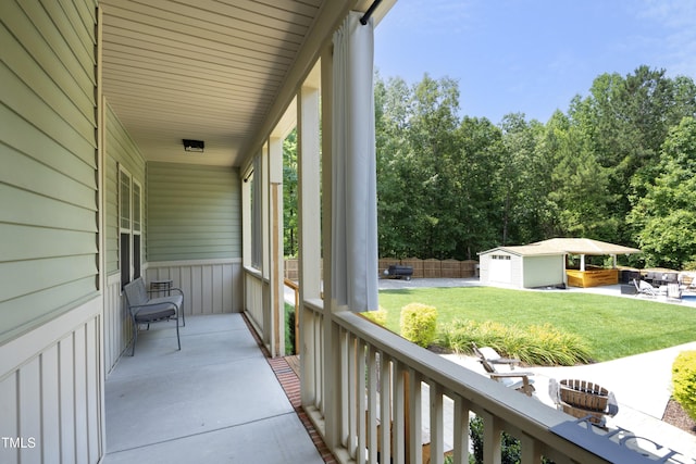 150 Churchill Rd, Louisburg, NC 27549 - view of patio featuring an outdoor structure and view of wooded area