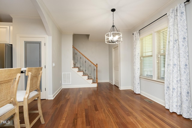 150 Churchill Rd, Louisburg, NC 27549 - unfurnished dining area featuring wood finished floors, a chandelier, stairway, baseboards, and ornamental molding