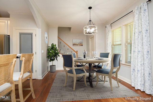 150 Churchill Rd, Louisburg, NC 27549 - dining area featuring a chandelier, stairs, wood finished floors, crown molding, and baseboards