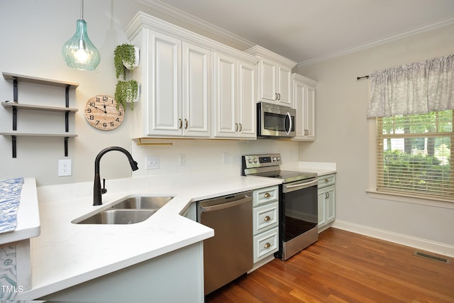 150 Churchill Rd, Louisburg, NC 27549 - kitchen featuring stainless steel appliances, a sink, light countertops, baseboards, and dark wood-type flooring