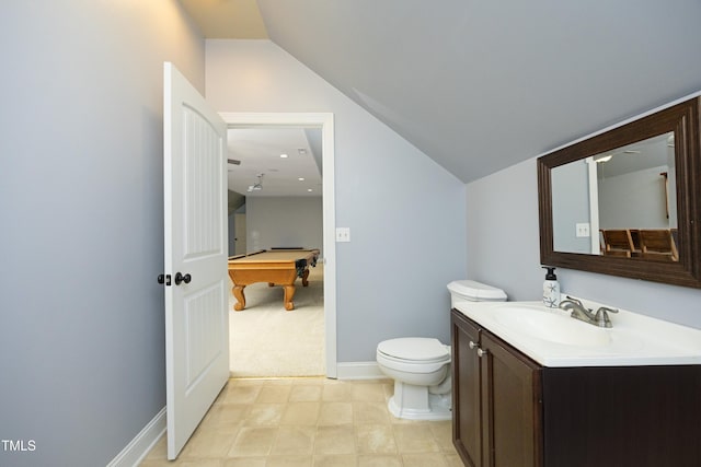 150 Churchill Rd, Louisburg, NC 27549 - bathroom with vanity, billiards table, toilet, lofted ceiling, and baseboards