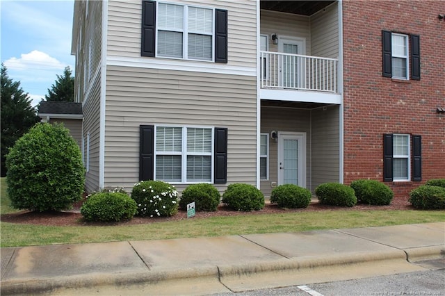 625 Marshtree Ln Unit 101, Fayetteville, NC 28314 - view of side of home featuring a balcony and brick siding