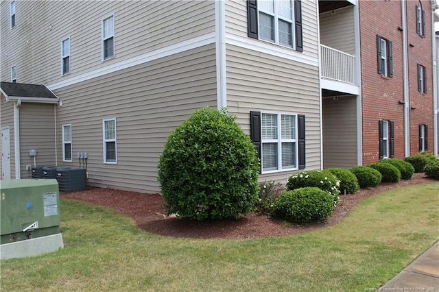 625 Marshtree Ln Unit 101, Fayetteville, NC 28314 - view of side of home with a yard and central air condition unit