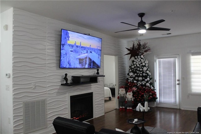 625 Marshtree Ln Unit 101, Fayetteville, NC 28314 - living area featuring ceiling fan, wood finished floors, a large fireplace, and baseboards