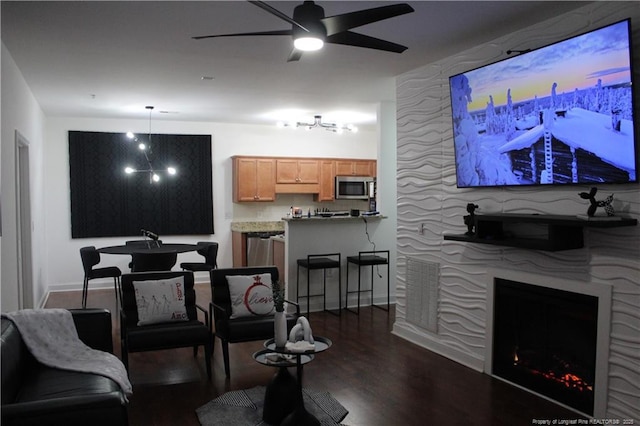 625 Marshtree Ln Unit 101, Fayetteville, NC 28314 - living area with dark wood-style floors, a ceiling fan, a premium fireplace, a chandelier, and baseboards