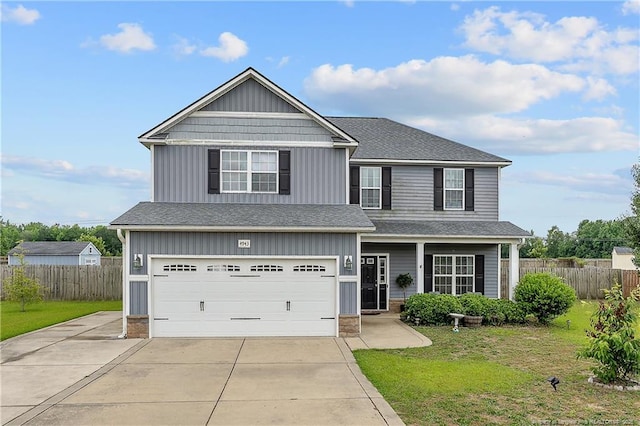 4943 Lion Heart Ln, Parkton, NC 28371 - view of front of property with an attached garage, concrete driveway, roof with shingles, and a porch