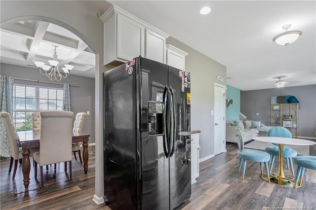 4943 Lion Heart Ln, Parkton, NC 28371 - kitchen featuring black fridge, dark wood-type flooring, a chandelier, baseboards, and coffered ceiling