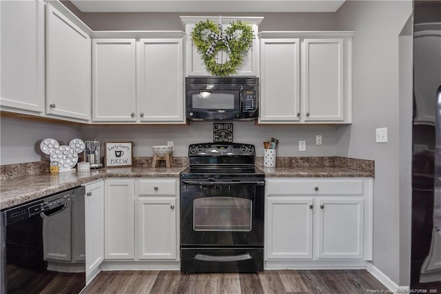 4943 Lion Heart Ln, Parkton, NC 28371 - kitchen featuring black appliances, wood finished floors, and white cabinets