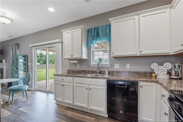 4943 Lion Heart Ln, Parkton, NC 28371 - kitchen with black appliances, a sink, dark wood finished floors, white cabinets, and recessed lighting