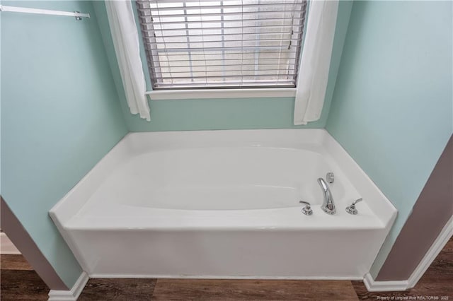 4943 Lion Heart Ln, Parkton, NC 28371 - full bath with a bath and wood finished floors