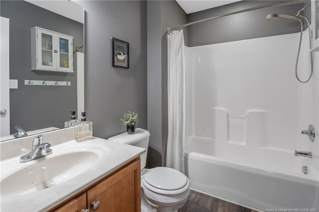4943 Lion Heart Ln, Parkton, NC 28371 - full bath featuring shower / bath combo with shower curtain, vanity, toilet, and wood finished floors