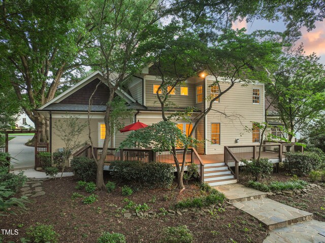 3324 Thomas Rd, Raleigh, NC 27607 - back of property at dusk with a deck
