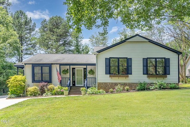 5617 Groomsbridge Ct, Raleigh, NC 27612 - tri-level home featuring a front lawn and covered porch