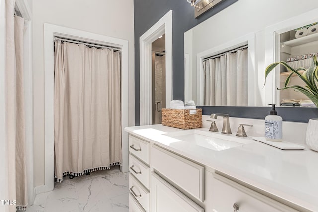 5617 Groomsbridge Ct, Raleigh, NC 27612 - bathroom featuring vanity and marble look tile flooring