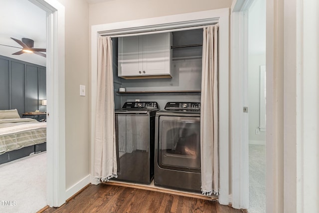5617 Groomsbridge Ct, Raleigh, NC 27612 - laundry room with cabinet space, ceiling fan, dark wood-type flooring, washer and dryer, and baseboards