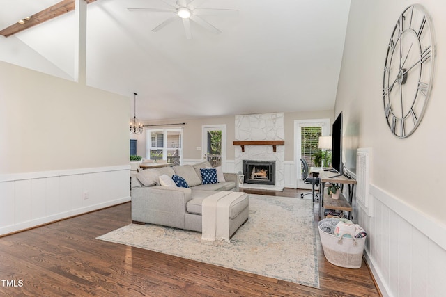 5617 Groomsbridge Ct, Raleigh, NC 27612 - living area with a fireplace, a wainscoted wall, wood finished floors, ceiling fan, and a chandelier