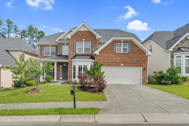 106 Elmsford St, Durham, NC 27703 - view of front facade with brick siding, an attached garage, concrete driveway, and a front lawn