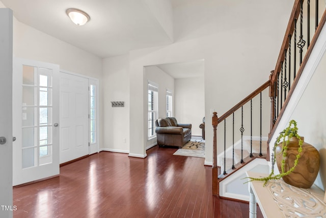 106 Elmsford St, Durham, NC 27703 - foyer entrance with wood finished floors, stairway, and baseboards