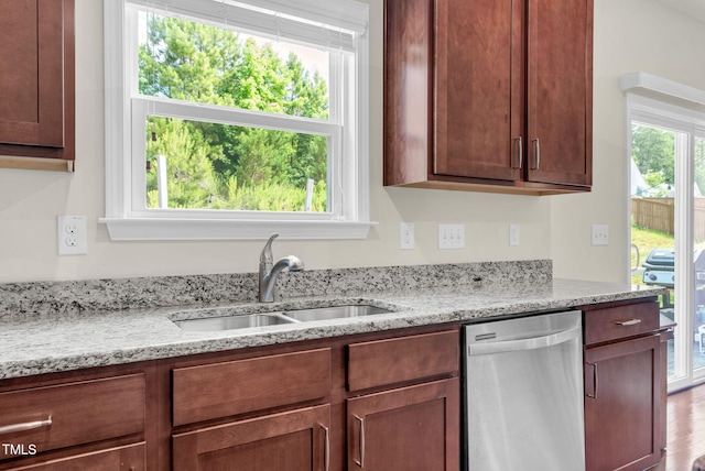 106 Elmsford St, Durham, NC 27703 - kitchen with dishwasher, a sink, and light stone countertops