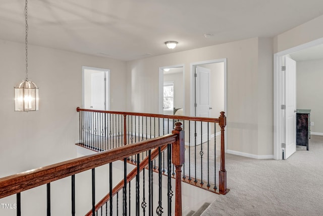 106 Elmsford St, Durham, NC 27703 - hall featuring an upstairs landing, light carpet, and baseboards