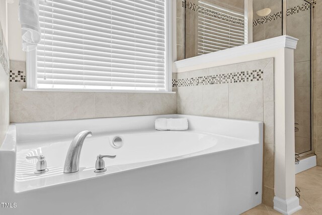 106 Elmsford St, Durham, NC 27703 - bathroom with a bath, tiled shower, and tile patterned flooring