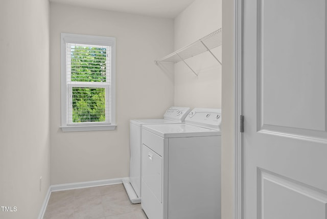 106 Elmsford St, Durham, NC 27703 - washroom with washing machine and dryer, baseboards, and light tile patterned floors