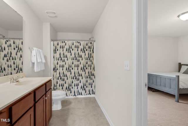 106 Elmsford St, Durham, NC 27703 - full bath featuring vanity, a shower with shower curtain, toilet, baseboards, and ensuite bathroom