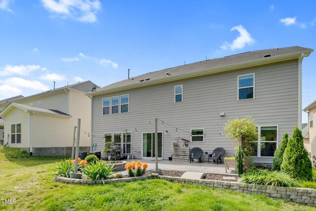 106 Elmsford St, Durham, NC 27703 - rear view of property featuring a patio area and a yard