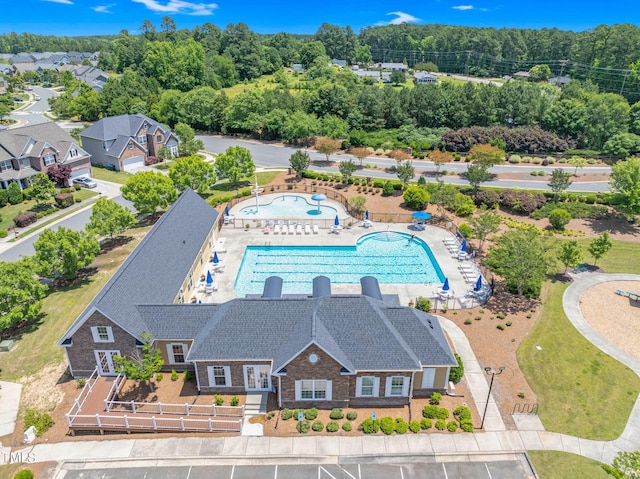 106 Elmsford St, Durham, NC 27703 - aerial view of property and surrounding area featuring a pool area and a tree filled landscape