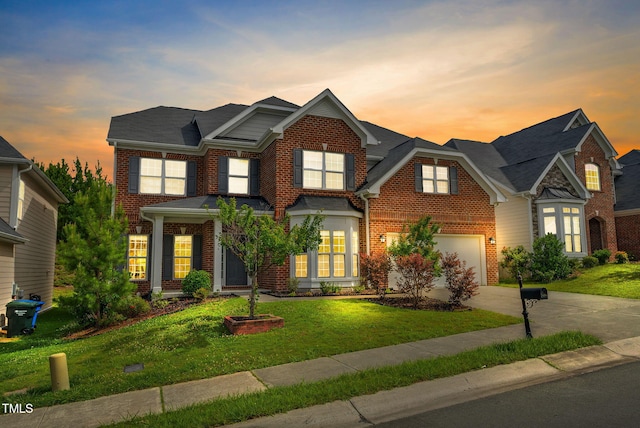 106 Elmsford St, Durham, NC 27703 - view of front of home featuring brick siding, driveway, and a lawn