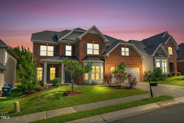 106 Elmsford St, Durham, NC 27703 - view of front of house with driveway, brick siding, and a front yard