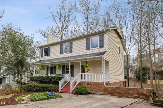 905 Balmoral Dr, Cary, NC 27511 - view of front facade with covered porch and a chimney