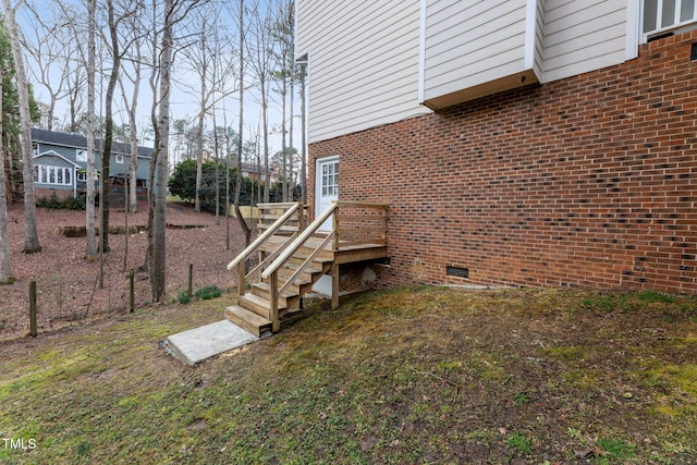 905 Balmoral Dr, Cary, NC 27511 - view of property exterior with crawl space, brick siding, and a wooden deck