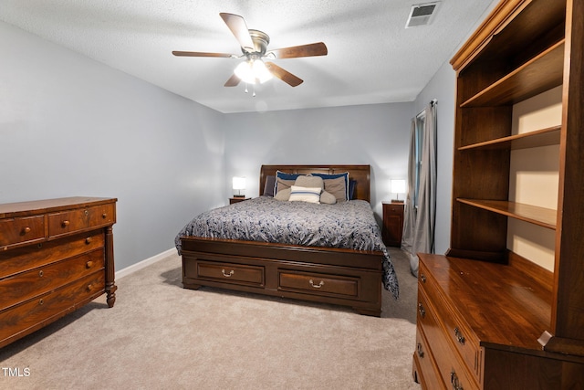 905 Balmoral Dr, Cary, NC 27511 - bedroom with light carpet, a textured ceiling, a ceiling fan, and baseboards