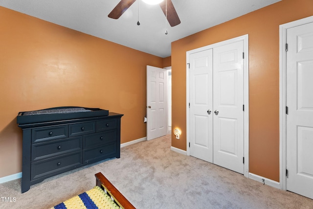 905 Balmoral Dr, Cary, NC 27511 - bedroom featuring light carpet, baseboards, a closet, and ceiling fan