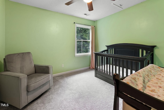 905 Balmoral Dr, Cary, NC 27511 - bedroom featuring carpet floors, baseboards, a ceiling fan, and a crib