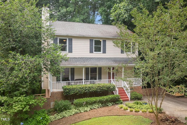905 Balmoral Dr, Cary, NC 27511 - view of front of property with a porch, a chimney, driveway, a shingled roof, and stairs