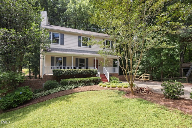 905 Balmoral Dr, Cary, NC 27511 - view of front of property featuring a chimney, covered porch, a front lawn, driveway, and stairway