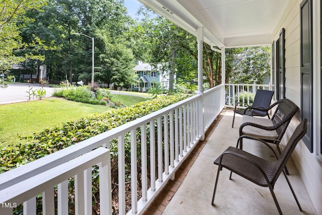 905 Balmoral Dr, Cary, NC 27511 - covered porch with view of scattered trees