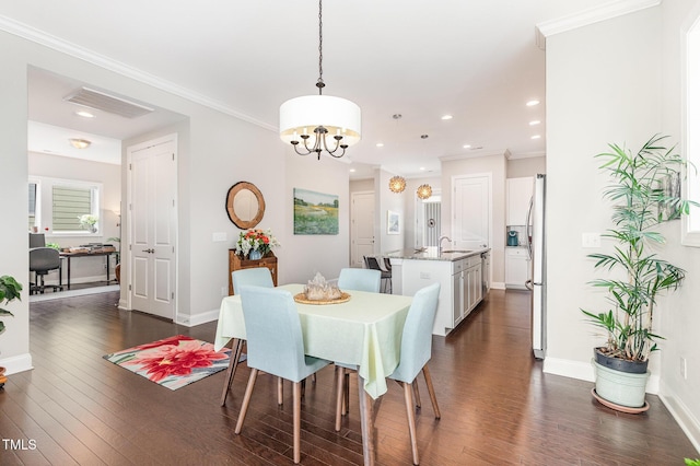 47 Coventry Ln, Chapel Hill, NC 27516 - dining area with a chandelier, dark wood-style flooring, baseboards, ornamental molding, and recessed lighting