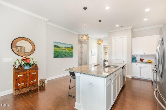 47 Coventry Ln, Chapel Hill, NC 27516 - kitchen featuring a sink, dark wood-style floors, recessed lighting, light stone counters, and a breakfast bar