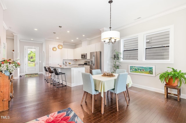 47 Coventry Ln, Chapel Hill, NC 27516 - dining room featuring a chandelier, dark wood-style floors, recessed lighting, baseboards, and crown molding