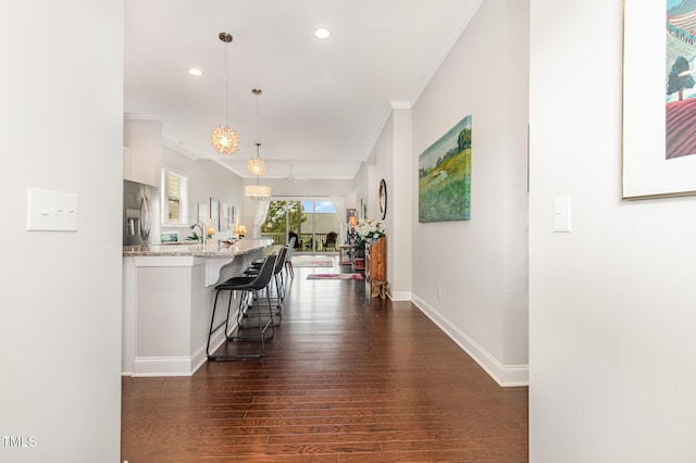 47 Coventry Ln, Chapel Hill, NC 27516 - hallway with ornamental molding, recessed lighting, dark wood-style flooring, baseboards, and a chandelier