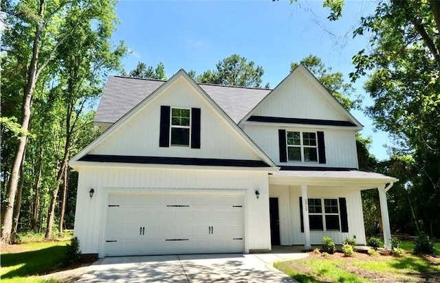 2312 Smith Rd, Hope Mills, NC 28348 - view of front of home featuring driveway, a porch, and a garage