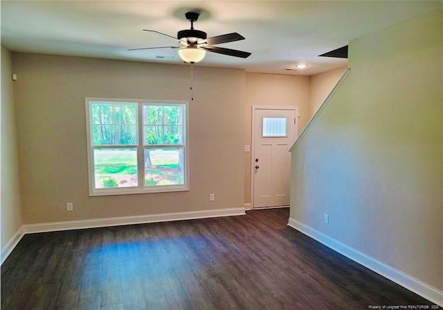2312 Smith Rd, Hope Mills, NC 28348 - unfurnished living room with dark wood finished floors, baseboards, and a ceiling fan