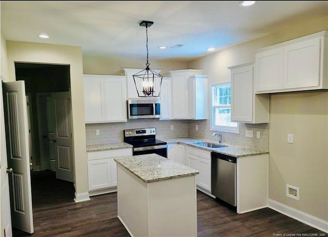2312 Smith Rd, Hope Mills, NC 28348 - kitchen with appliances with stainless steel finishes, a sink, a center island, dark wood-type flooring, and a chandelier